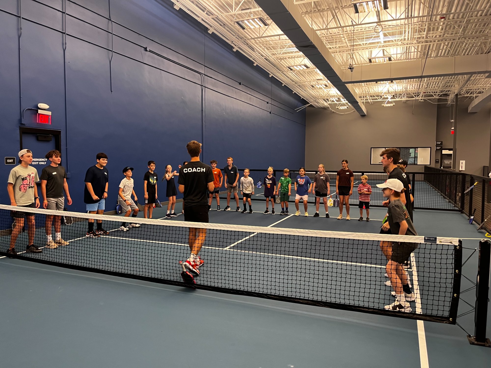Cody coaching youth pickleball
